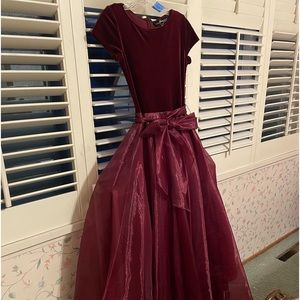 Rich wine-colored velvet cap sleeved top on flowing formal dress skirt.   ,